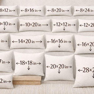 May include: A selection of white cushions in various sizes, including 20 x 30 cm, 20 x 40 cm, and 71 x 71 cm. Each cushion has its dimensions labeled with black text, arranged on a neutral surface.