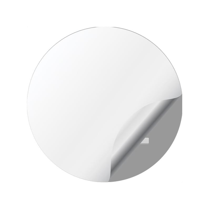 May include: A white, circular sticker with a corner peeled back, revealing a gray surface underneath. The sticker is clean and smooth, with a slight curve where it is peeled.