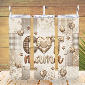 May include: A beige and brown tumbler with a patchwork design featuring hearts, paw prints, and yarn balls. The words "Cat Mama" are displayed in a decorative font. Includes a silver straw and lid.