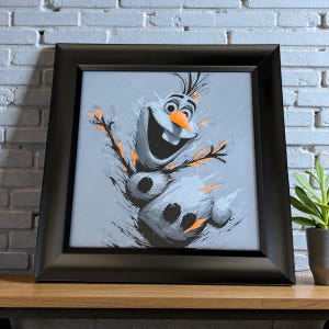 May include: Framed artwork featuring Olaf from Frozen. The image showcases a stylized, smiling Olaf with orange accents and a carrot nose against a gray background. The artwork is enclosed in a black frame, adding a modern touch to the whimsical design.