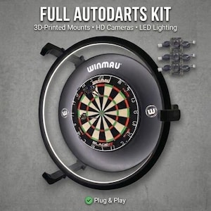 May include: A full autodarts kit featuring a Winmau Blade 6 dartboard mounted within a black circular frame with integrated LED lighting, three HD cameras, and 3D-printed mounts. The text reads FULL AUTODARTS KIT, 3D-Printed Mounts, HD Cameras, LED Lighting, and Plug & Play.