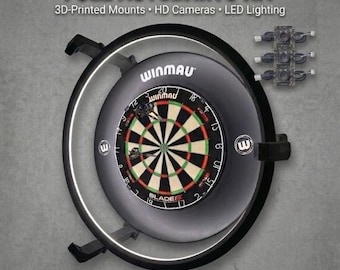 May include: A full autodarts kit featuring a Winmau Blade 6 dartboard mounted within a black circular frame with integrated LED lighting, three HD cameras, and 3D-printed mounts. The text reads FULL AUTODARTS KIT, 3D-Printed Mounts, HD Cameras, LED Lighting, and Plug & Play.