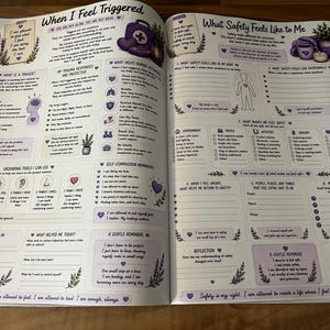 May include: An open mental health workbook with two pages titled When I Feel Triggered and What Safety Feels Like to Me. The pages feature purple text, illustrations of a first aid kit, lavender, and a human outline, with fillable sections.