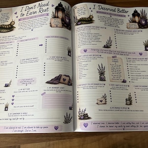 May include: An open workbook with two pages titled I Don't Need to Earn Rest and I Deserved Better. The pages feature illustrations of caterpillars, lanterns, lavender, and butterflies, with various prompts, checklists, and blank lines for writing.