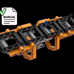 May include: An orange and black construction toy model with a blue peg and gray pieces. The word "MANUAL" is printed on a white document with a green checkmark. The toy is set against a black background.