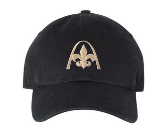 St. Louis Fleur De Lis Baseball Cap - a STL city pride hat for men or women featuring the arch with with a fleur de lis inside.