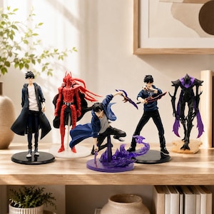 May include: A collection of five anime-style character figures displayed on a wooden surface. The set includes figures in various poses, featuring a red armored knight, a dark creature with purple accents, and three human figures in casual attire.