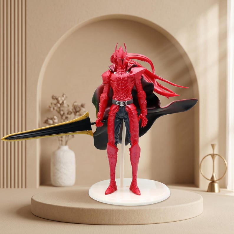 May include: A red armored action figure standing on a circular white base. The figure wears a red helmet and chest plate, dark pants, and a flowing black cape. It holds a long, pointed sword with a black blade and gold trim in its right hand.