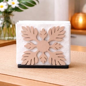 May include: A white ceramic mug with a black handle and the text "But First, Coffee" in a bold, black font. The mug is set against a neutral background, highlighting its simple design.