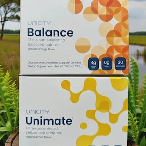 May include: Two rectangular boxes of Unicity dietary supplements stacked vertically. The top box is Balance with orange circular patterns, 4g soluble fibre, 0g sugar, and 30 stick packs. The bottom box is Unimate with yellow organic shapes, 3g yerba mate, 0g added sugar, and 30 stick packs.