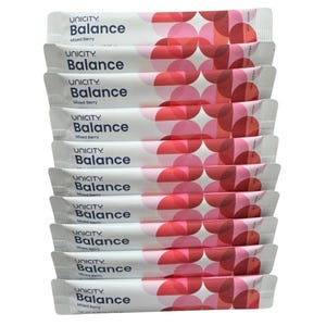 May include: A stack of ten white Unicity Balance Mixed Berry supplement packets. Each individual packet features the brand name Unicity, the product name Balance, and the flavour Mixed Berry in dark blue text, alongside a geometric pattern of pink and red circles.