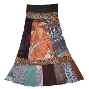 May include: A long, multi-coloured skirt made from recycled fabric. The skirt has a brown waistband and features a variety of patterns, including floral, paisley, and geometric designs. The skirt is a patchwork of different fabrics and colours, creating a unique and eclectic look.