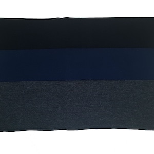 May include: Three fabric swatches in different shades of blue. The top swatch is a dark navy blue, the middle swatch is a medium blue, and the bottom swatch is a light blue with a subtle texture.
