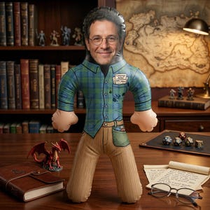 May include: An inflatable doll featuring a printed image of a person with glasses wearing a blue and green plaid shirt and tan pants. The shirt pocket contains papers labeled Campaign Notes and NPC Ideas. The doll has a smooth, glossy finish.