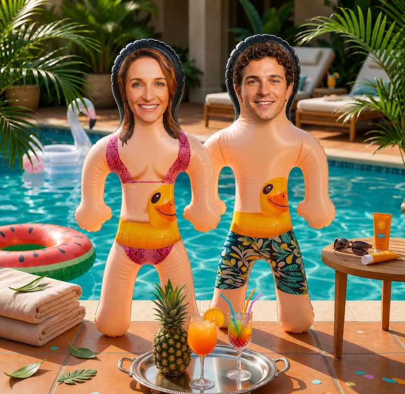 May include: Two inflatable pool floats featuring custom photo faces, one wearing a pink bikini and the other wearing patterned swim trunks, both with yellow duck inner tubes around their waists, positioned near a swimming pool with tropical plants.