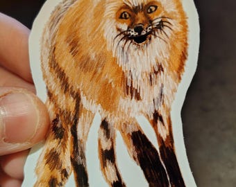 May include: A sticker featuring a detailed illustration of a fox. The fox has orange and brown fur, with black markings on its legs. The fox is depicted in a standing position with an open mouth, giving it a playful expression.