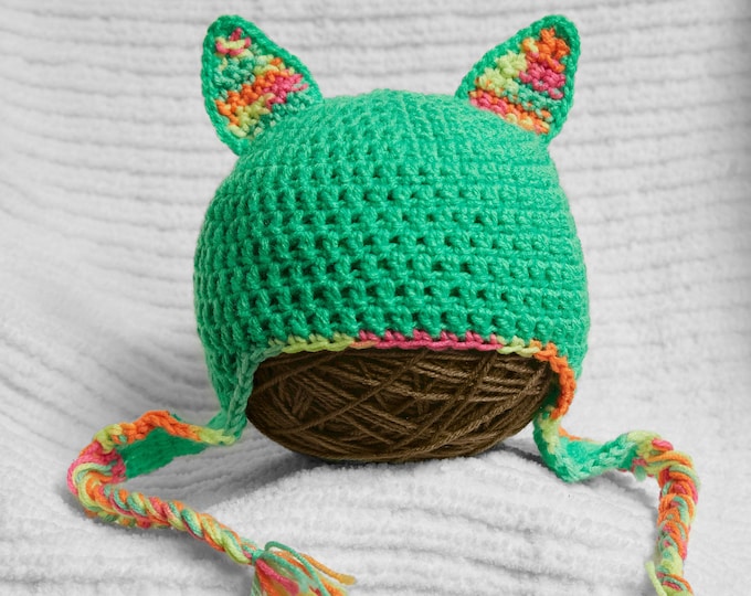 Kitty ear hat crocheted light green ear flap hat with neon rainbow accents.