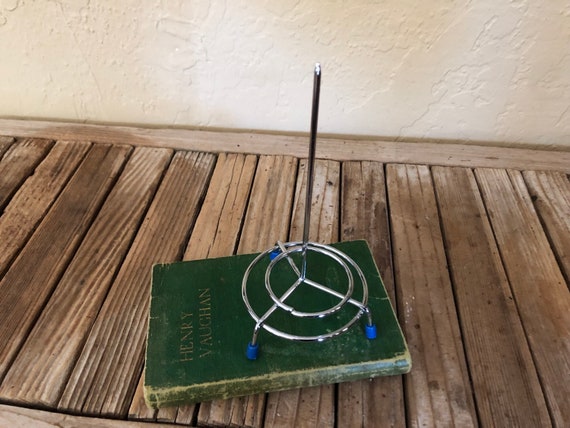 Silver and Blue Metal Receipt Stand