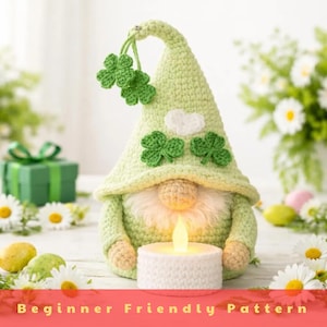 May include: A white ceramic mug with a black handle and the text "But First, Coffee" in a bold, black font. The mug is filled with a dark liquid, likely coffee, and sits on a light-colored surface.