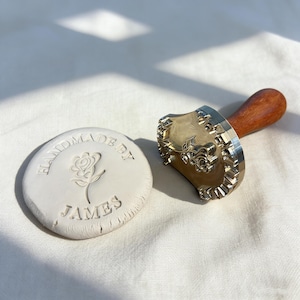 May include: A set of three ceramic mugs with a speckled, matte finish. The mugs are in shades of cream, light gray, and dark gray. Each mug has a simple, minimalist design, perfect for coffee or tea.