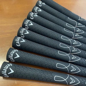 May include: A set of three ceramic mugs with a speckled, matte finish. The mugs are in shades of cream, light gray, and dark gray. Each mug has a simple, minimalist design, perfect for coffee or tea.