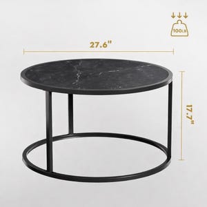 May include: Round black marble-top coffee table with a black metal frame. The table is 27.6 inches in diameter and 17.7 inches high. The table can hold up to 100 pounds.