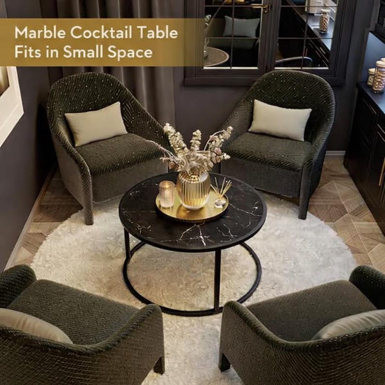 May include: A black marble cocktail table with a gold tray, surrounded by four green woven armchairs. The table has a black metal base and is set on a white rug. The text "Marble Cocktail Table Fits in Small Space" is visible.