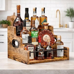 May include: A tiered wooden liquor shelf displaying various bottles of spirits. The shelf has a rustic, weathered appearance with black metal accents. Bottles of whiskey, cognac, and other liquors are arranged on the three levels.