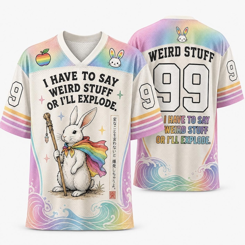 May include: A white V-neck jersey featuring a rainbow gradient trim, a rabbit wearing a rainbow cape and holding a staff, and the text "I HAVE TO SAY WEIRD STUFF OR I'LL EXPLODE." The back displays "WEIRD STUFF" with the number "99" and wave graphics.