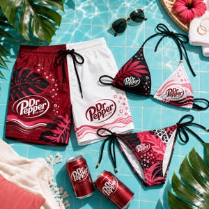 May include: A pair of split-color maroon and white swim trunks with a black drawstring, a matching bikini top and bottom with black ties, and two aluminum cans of Dr. Pepper. The apparel features the Dr. Pepper logo, tropical leaf patterns, and bubbles.