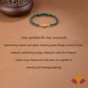 May include: A green bracelet with a gold knot design. The bracelet is made of a woven green material with gold accents. The text in the image says "Green symbolizes life, hope, and growth."