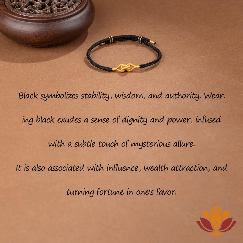 May include: A black bracelet with gold accents and a knot design. The bracelet is on a brown surface. Text on the image reads: Black symbolizes stability, wisdom, and authority. Wear. It is also associated with influence, wealth attraction, and turning fortune in one's favor.