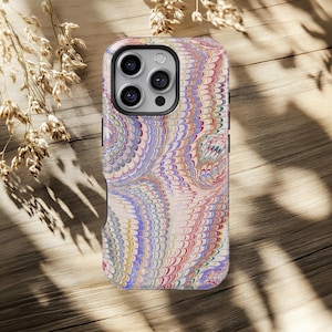 May include: A smartphone case with a colorful, marbled design. The case features a swirling pattern of blues, reds, yellows, and purples, creating a unique and artistic look. The case has a black border and cutouts for the camera and buttons.