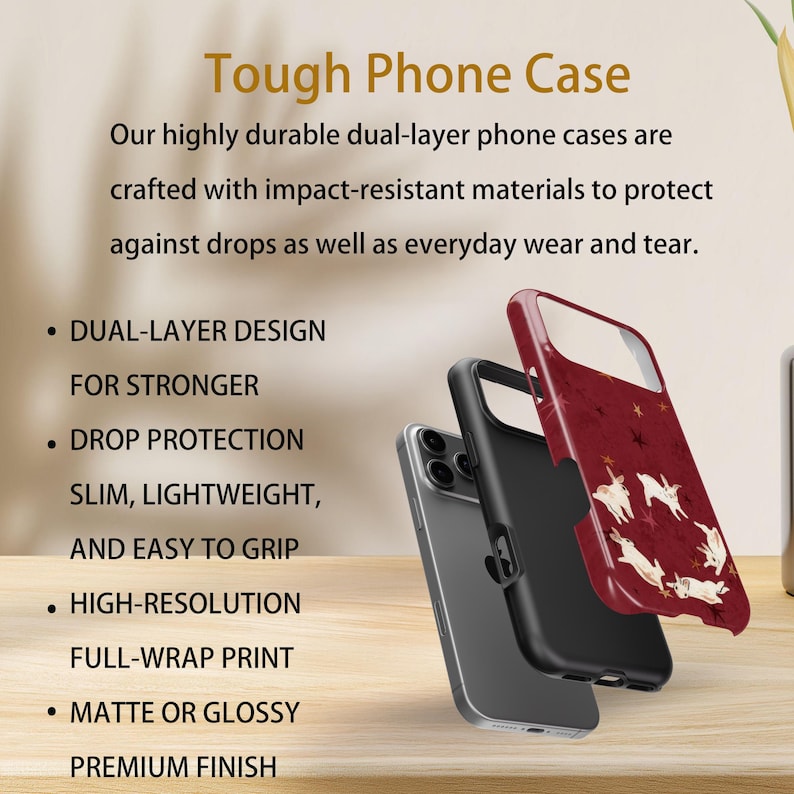 May include: A phone case with a dual-layer design, drop protection, and a premium finish. The case is shown in three parts: a clear phone, a black inner case, and a red outer case with a white animal and star pattern. The text reads "Tough Phone Case".