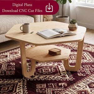 May include: A light wood, two-tiered coffee table with an octagonal top and curved legs. A book, mug, and small succulent plant sit on the table. The table is on a patterned burgundy rug. Text on the image reads "Digital Plans Download CNC Cut Files."