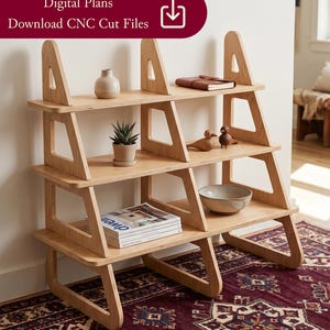 May include: A light-colored wooden bookshelf with a unique, geometric design. The shelves are filled with decorative items like a small plant, a ceramic bowl, and a stack of magazines. The text "Digital Plans Download CNC Cut Files" is visible.