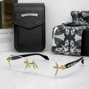 Rektangulära blåljusglasögon utan bågar med guldkorsdetalj – Lyxiga unisexbågar för gatan