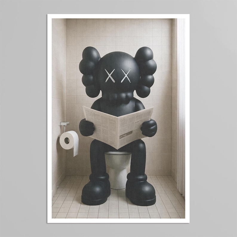 May include: A matte black KAWS character figure with signature X-shaped eyes sits on a white toilet, holding an open newspaper. The figure has rounded ears and large feet, positioned in a tiled bathroom with a white toilet paper roll nearby.