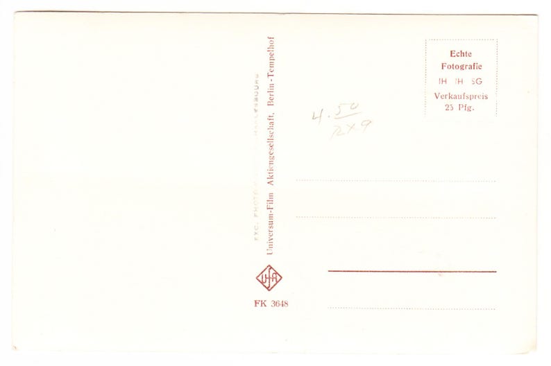 May include: A white ceramic mug with a black handle and the text "But First, Coffee" in a handwritten style. The mug is on a white surface. The mug is approximately 10 cm tall.