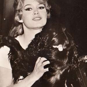 May include: A rectangular wooden sign, distressed for a rustic look, bearing the handwritten text "Welcome to our home". The sign is designed for indoor or outdoor use, with a simple, welcoming aesthetic.