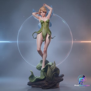 May include: A fairy figurine with blonde hair, wearing a green leaf-inspired dress and translucent blue wings. The figure stands on a dark, textured base resembling foliage. The text PrintAuroraArt STL STORE is visible in the bottom right corner.