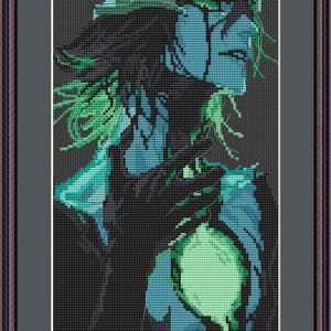 May include: A framed cross-stitch embroidery depicting a stylised profile of a figure with dark hair, rendered in shades of black, teal, and vibrant green. The artwork features a glowing green circular element on the chest and is set in a dark frame.