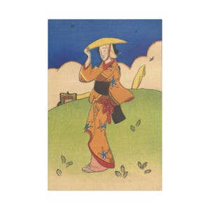 May include: A vintage Japanese woodblock print depicting a woman in a kimono holding a yellow hat. The kimono is orange with blue star patterns. The background shows a green hill, blue sky, and clouds.
