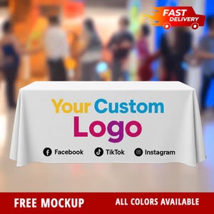 May include: A white tablecloth with the text "Your Custom Logo" in yellow, blue, and pink. Social media icons for Facebook, TikTok, and Instagram are below the logo. The words "FREE MOCKUP" and "ALL COLORS AVAILABLE" are at the bottom.
