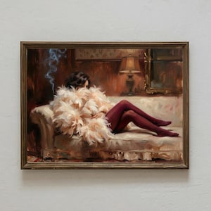 May include: Oil painting of a person reclining on a white sofa, wearing a fluffy, light pink feather boa and burgundy stockings. A lit cigarette emits blue smoke. The artwork is framed in a brown wooden frame.