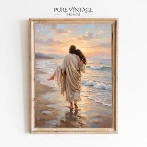 May include: Framed art print depicting a figure carrying another figure along a beach at sunset. The figures are dressed in flowing robes, with the sea and sky in the background. The print is labeled "PURE VINTAGE PRINTS" at the top.