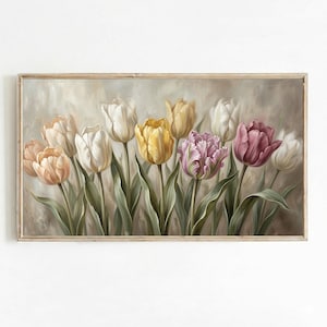 May include: A framed painting of tulips in various colours, including white, yellow, pink, and peach. The flowers have green stems and leaves, set against a soft, neutral background. The artwork is in a rectangular, light-coloured wooden frame.