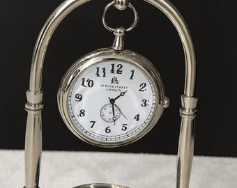 Reloj de sobremesa de níquel con brújula, decoración náutica vintage.