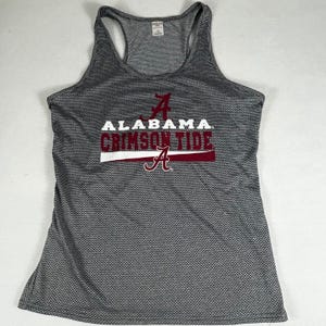 May include: Gray athletic tank top with a racerback design. The front features the text "ALABAMA CRIMSON TIDE" in white and crimson, along with the letter "A" in crimson.