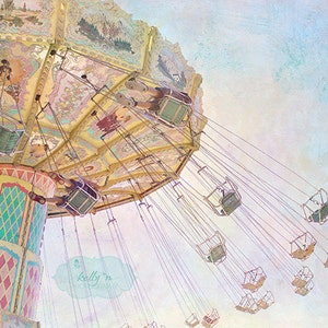 May include: A vintage-style carousel with colorful painted details and hanging seats. The carousel is set against a soft, pastel background.